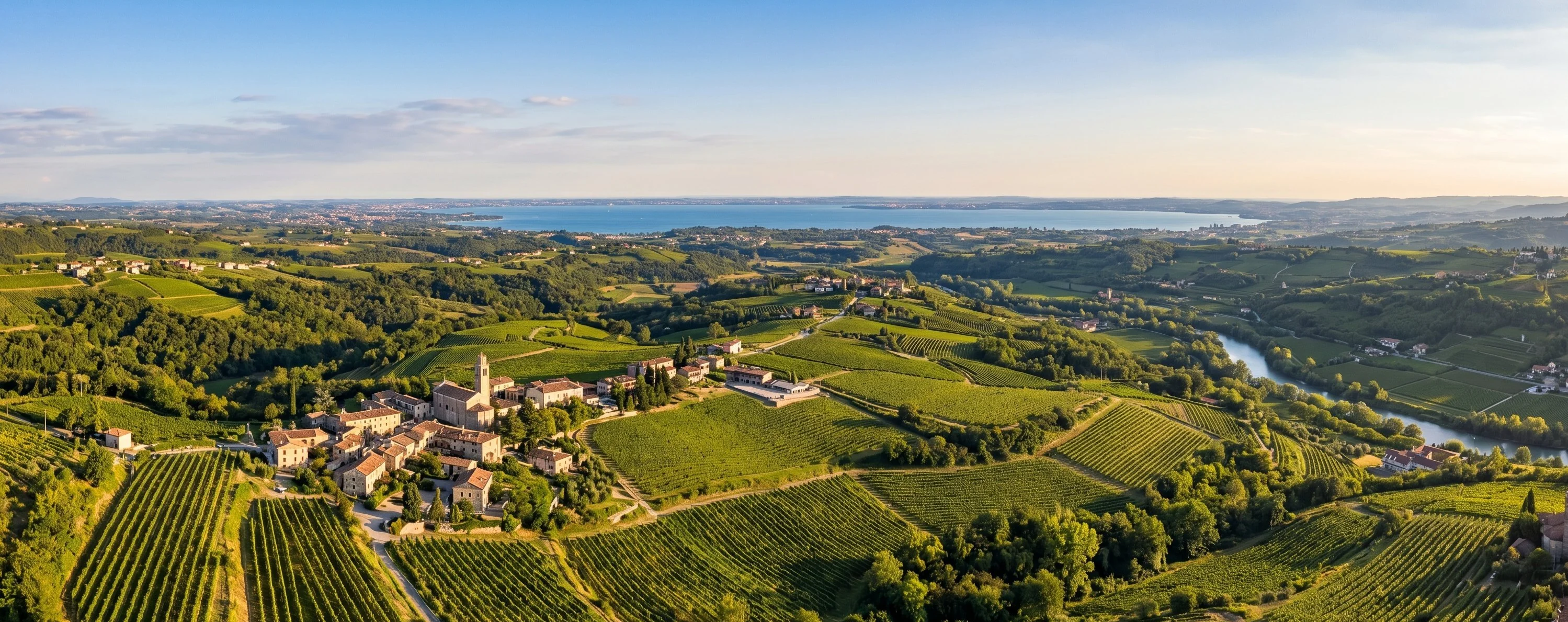 Aerial view of Valpolicella valley with Lake Garda visible in background, Veneto Italy